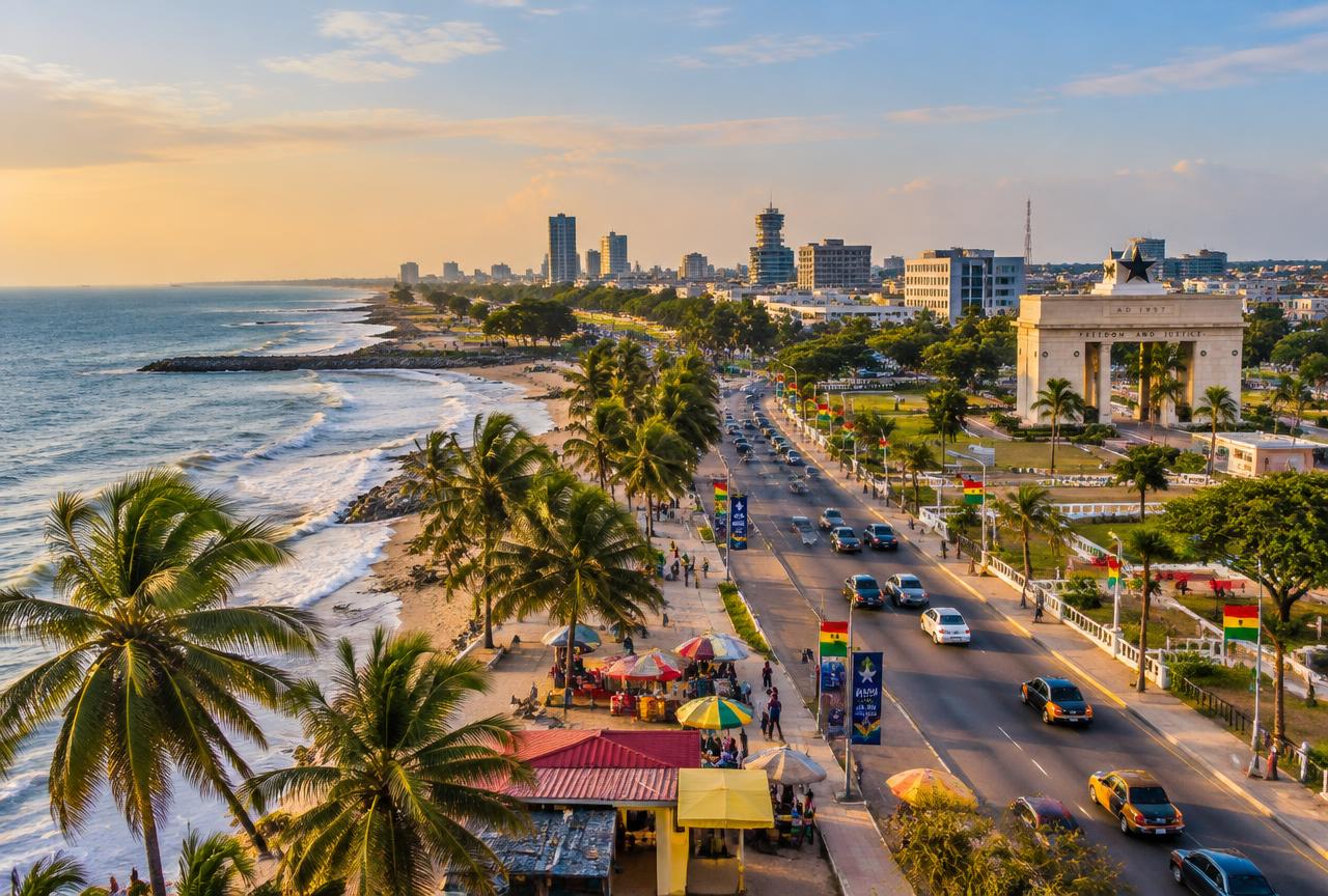 Coastal road, palm trees and the Independence Arch in Accra, Ghana
