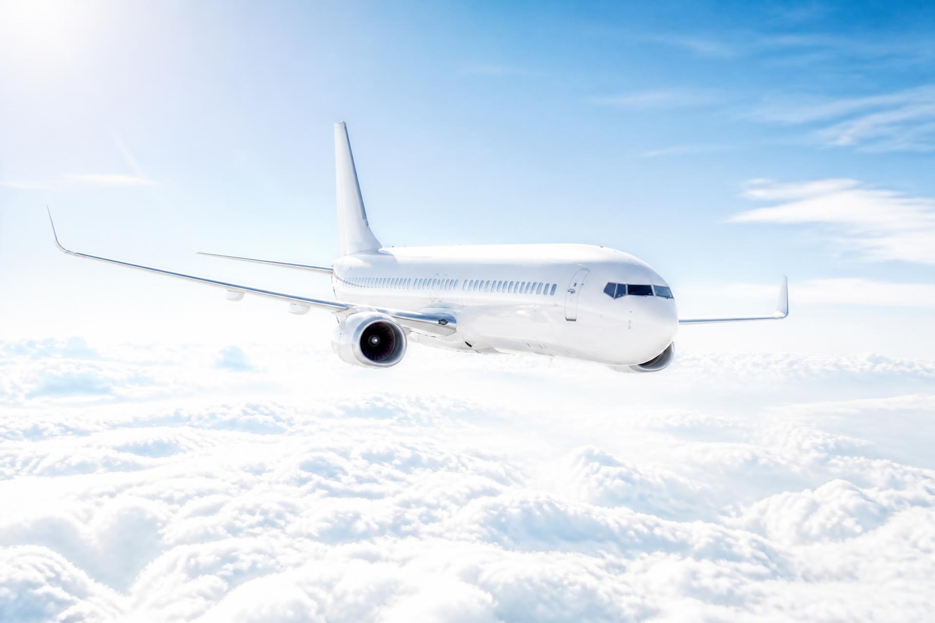 Passenger aircraft cruising above the clouds